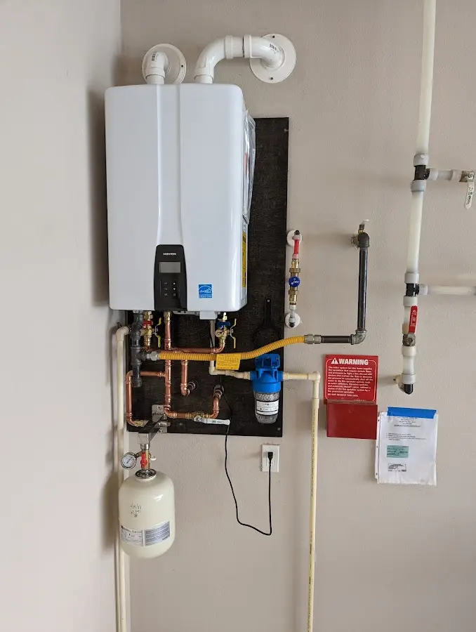 Professional plumber installing copper piping in a Albert Lea home